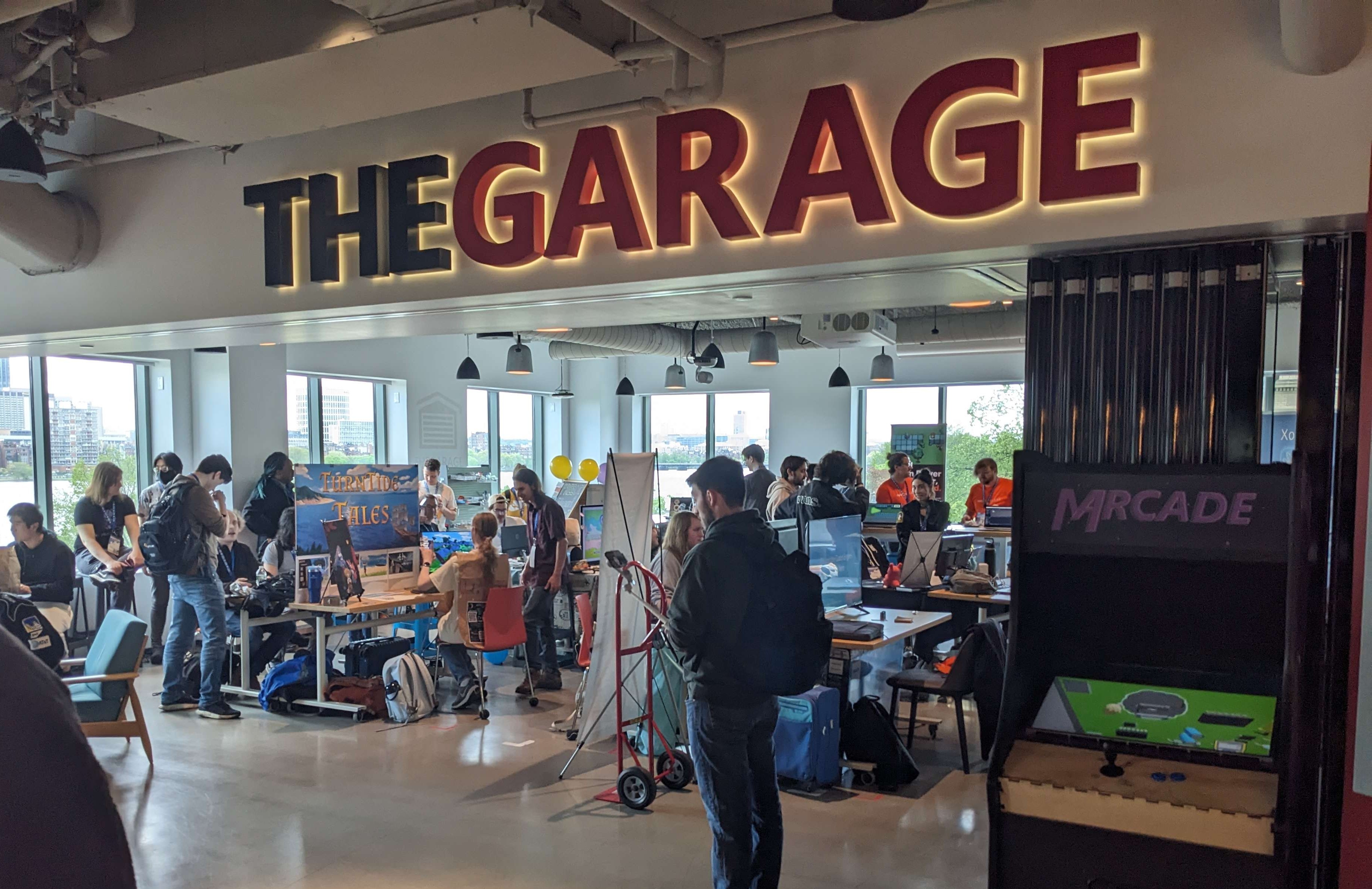 Shot of the Garage, our showcase venue, filled with people playing games.