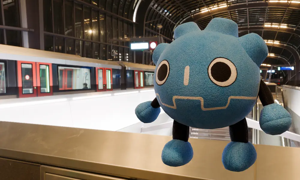 A subway with the Godot plush besides